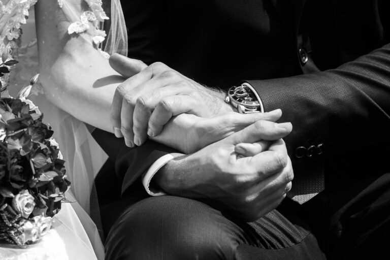 Detail of holding hands in a black&white wedding photograph